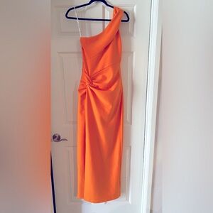Marciano one shoulder orange gown with slit in the front leg
